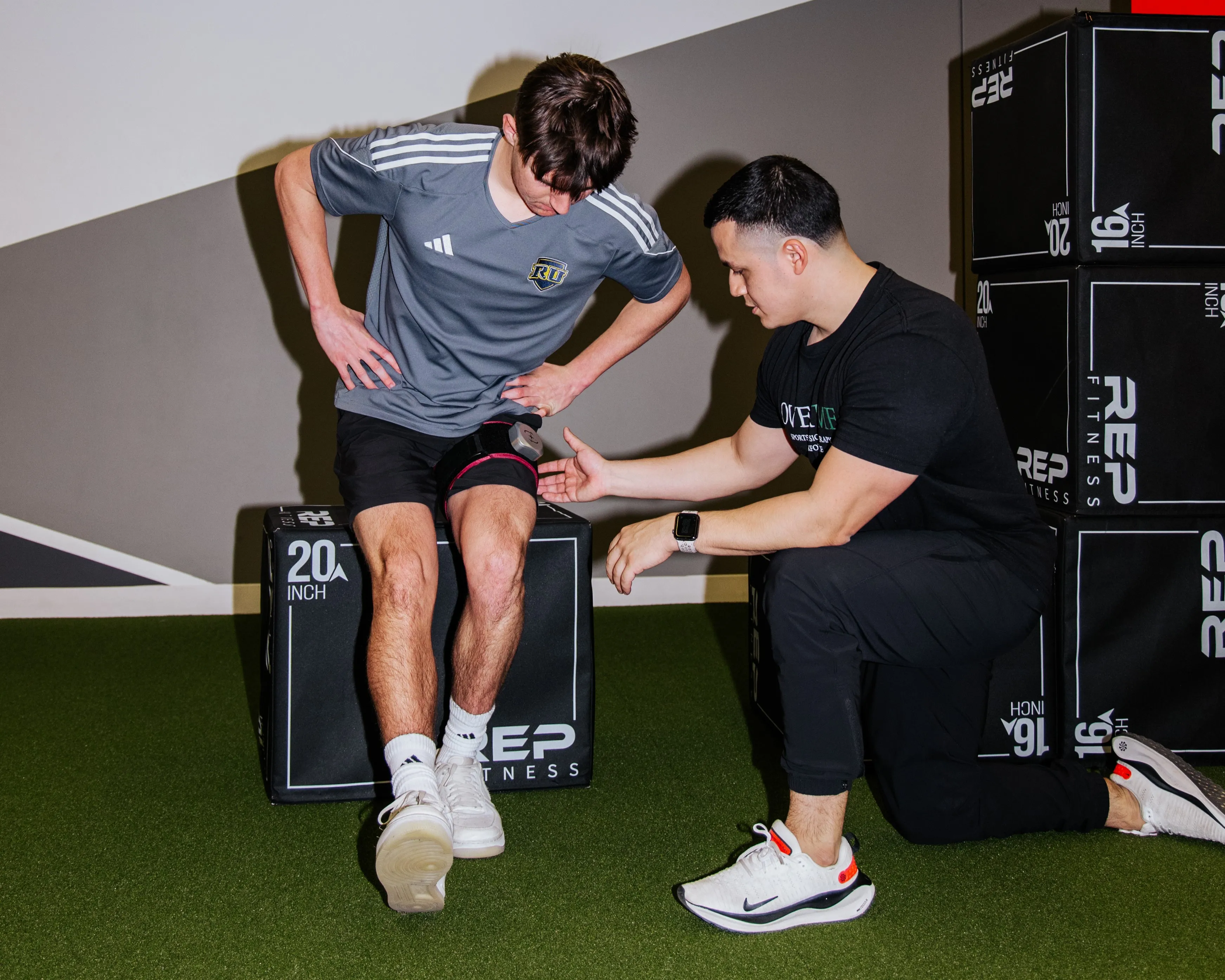 A client performs physical therapy with a band to partial restrict blood flow.