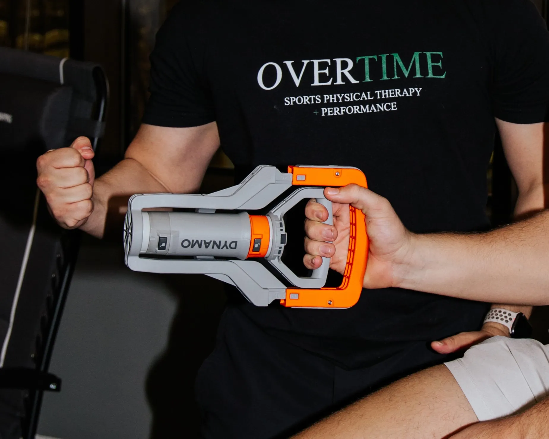 Dr. Benitez shows a client how to perform Dyanamo strength testing.