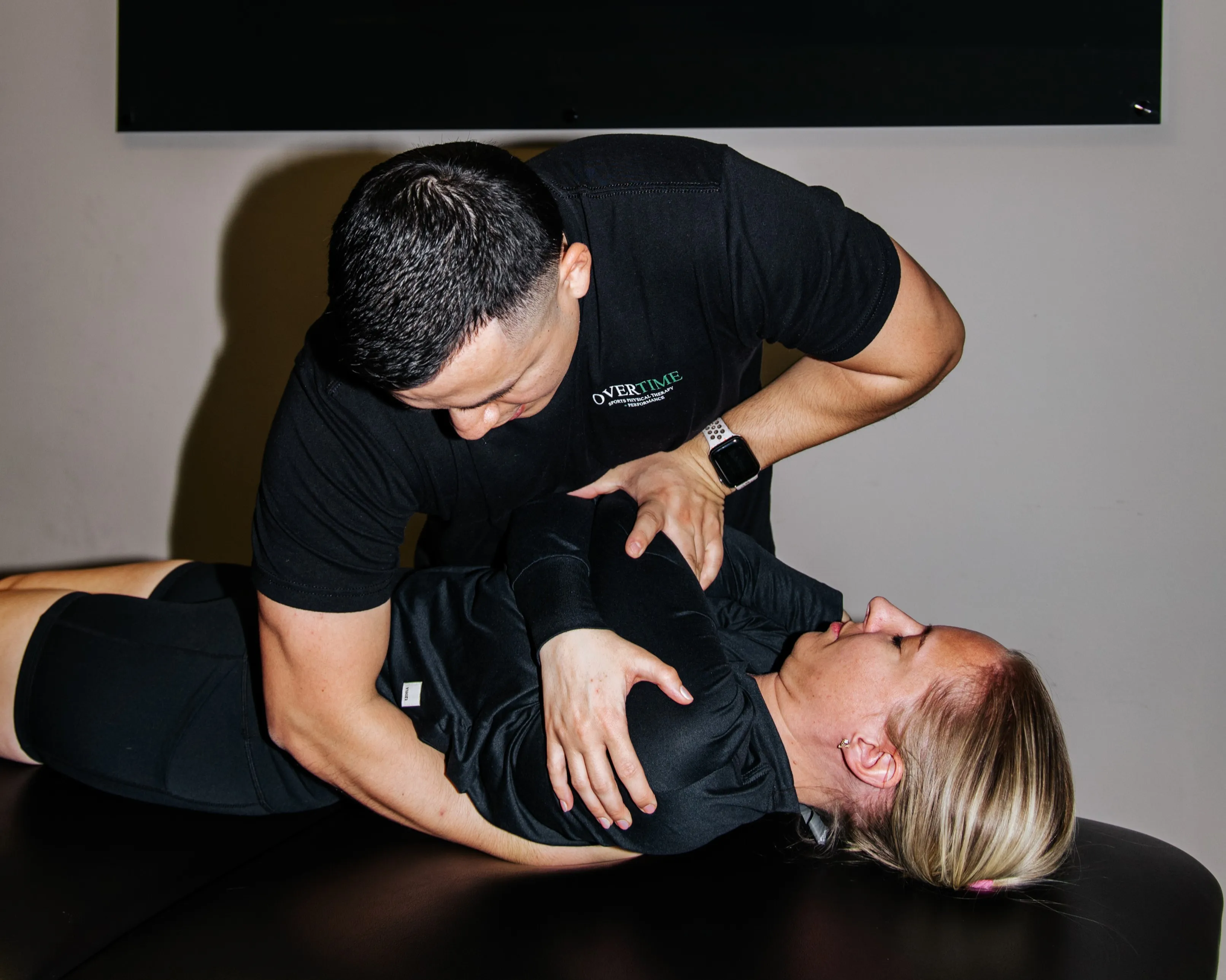 Dr. Benitez performs manipulation therapy on a client to improve shoulder pain.