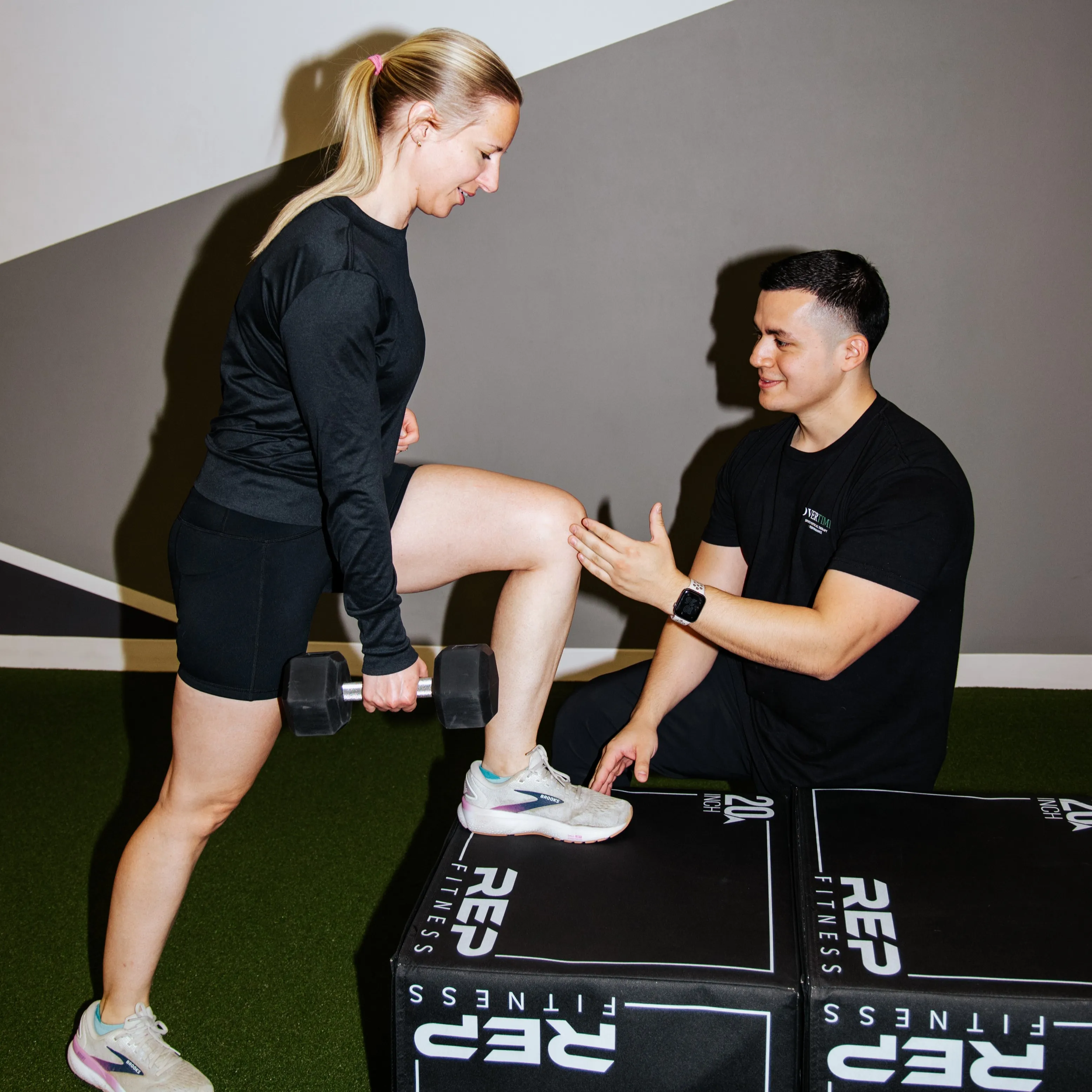 Dr. Benitez works with a physical therapy client.